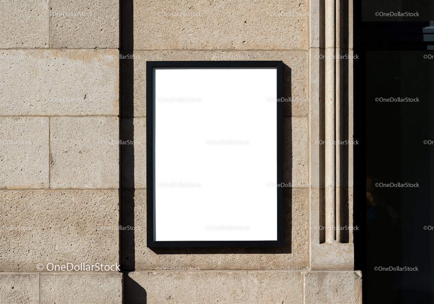 Blank Black Frame Mounted on Stone Wall Outdoors