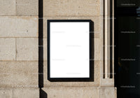 Blank Black Frame Mounted on Stone Wall Outdoors
