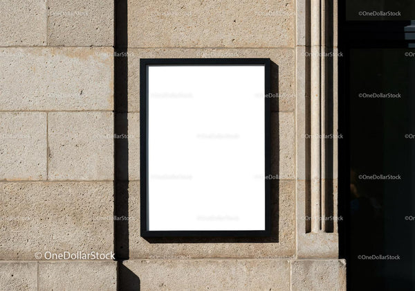 Blank Black Frame Mounted on Stone Wall Outdoors JPG Mockup Image