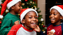 Joyful kids celebrating Christmas by decorated tree