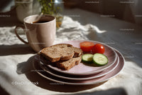 Slice of Toasted Bread with Cucumber and Cherry Tomatoes on Pink Plate