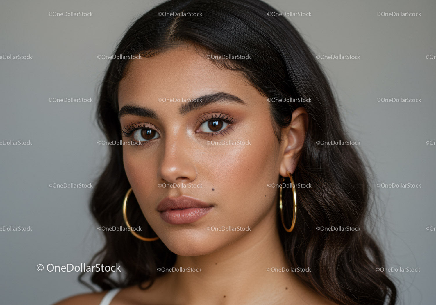 Close-up of a Young Woman with Brown Eyes and Long Dark Hair in Stylish Makeup