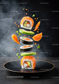 Fresh salmon sushi rolls with avocado and greens floating