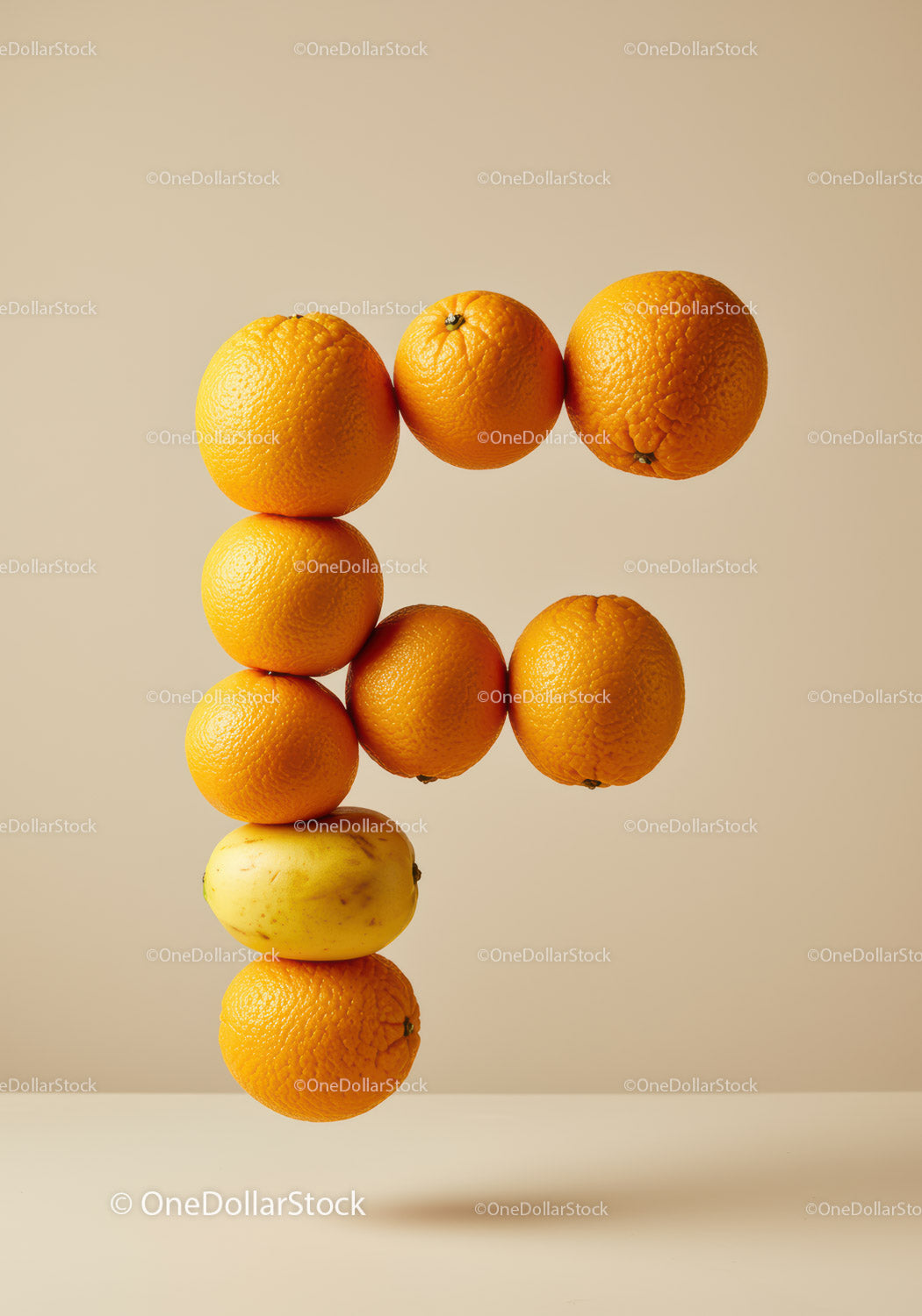 Letter F formed by floating fresh citrus fruits