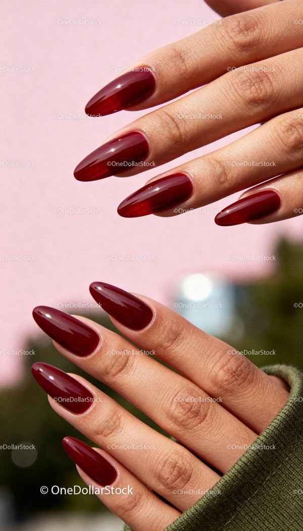 Close-up of stylish red almond-shaped manicured nails