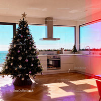 Modern kitchen with decorated Christmas tree and ocean view