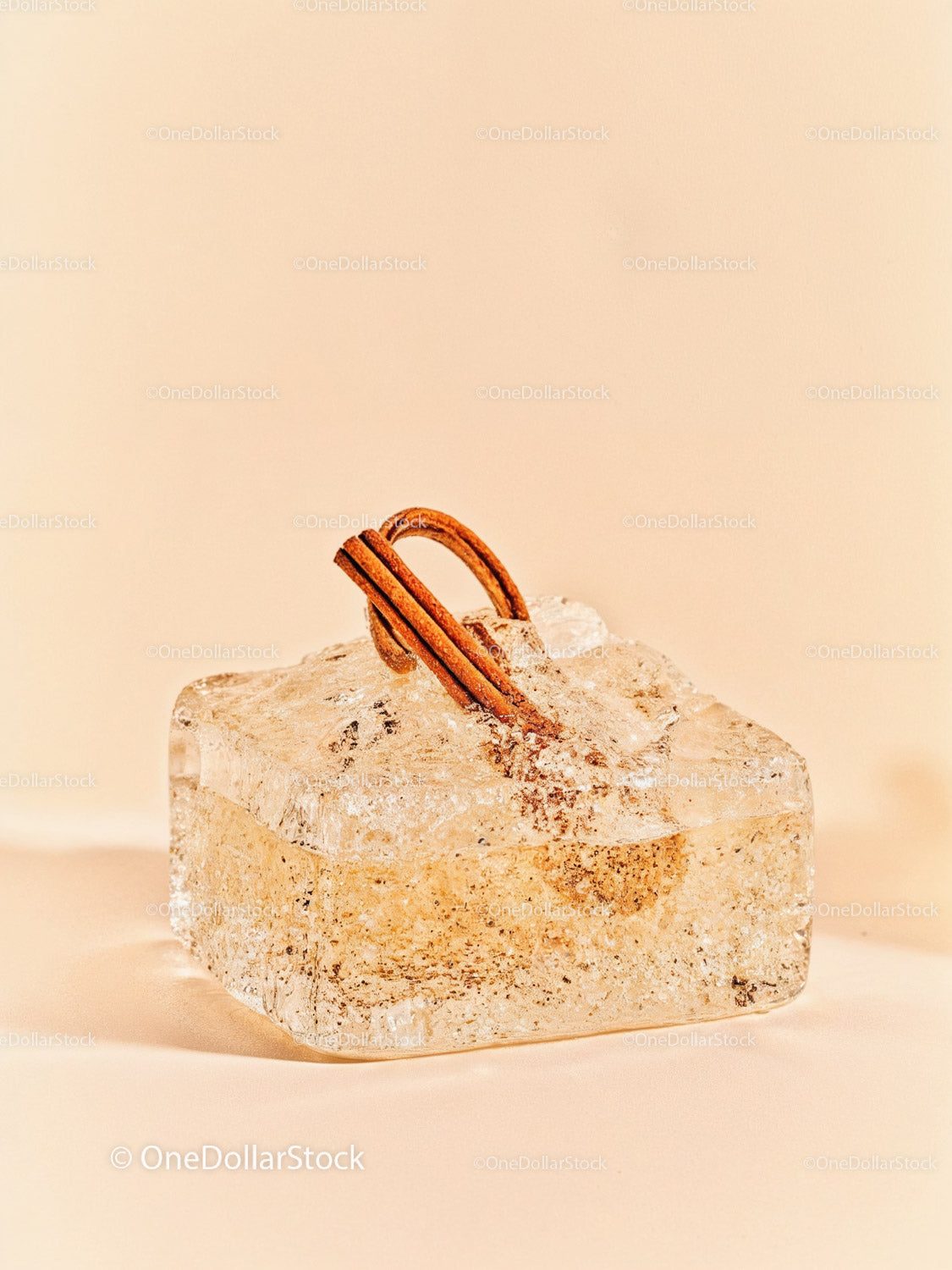 Cinnamon sticks frozen in transparent ice block