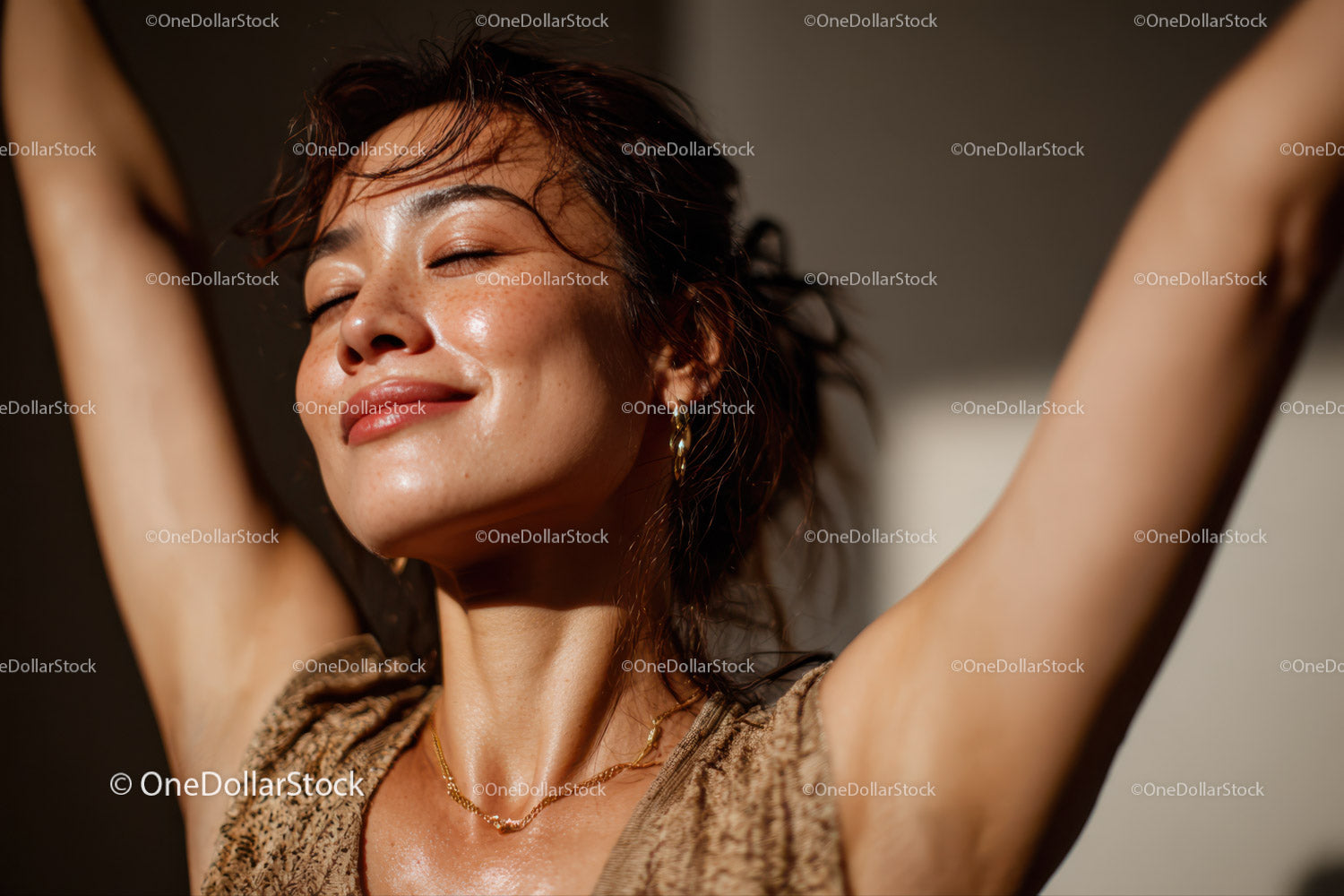 Joyful Woman Relaxing in Warm Sunlight With Closed Eyes