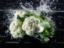 Fresh Cauliflower with Water Splash in a Vibrant Culinary Scene