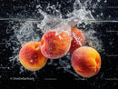 Fresh Peaches Splashing into Water with Refreshing Juice Effect