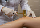 Medical Professional Performing Muscle Therapy with Hammer Tool