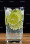Refreshing sparkling water with lime slices and ice cubes