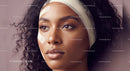 Close-up Portrait of a Woman with Curly Hair and Flawless Skin