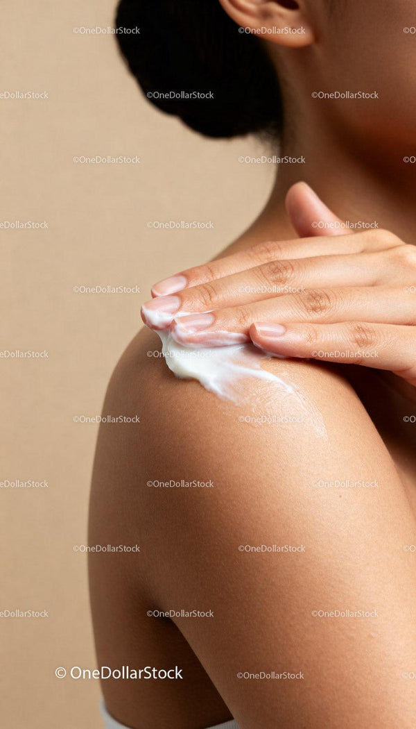 Applying moisturizing cream on smooth shoulder skin