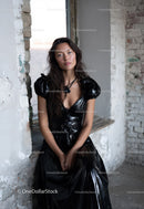 Fashion Model Sitting in Indoor Loft with Brick Wall Background