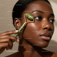 Close Up of a Woman Using Jade Roller for Skin Rejuvenation