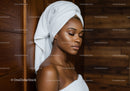 Relaxing Woman with Towel Wrap at Spa with Wooden Wall