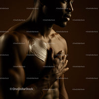Elegant Female Body with Metallic Gold Paint in Artistic Pose
