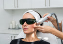 Woman Receiving Laser Skin Rejuvenation Treatment in Modern Clinic