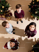 Happy children celebrating Christmas with festive decor