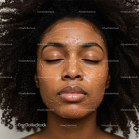 Close-up of Black Woman with Facial Mask and Natural Hair