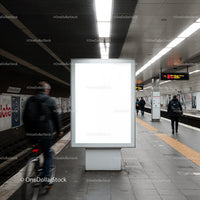Blank advertising board in modern urban subway station