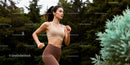 Focused young woman running outdoors in serene park