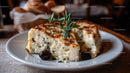 Blue Cheese and Rustic Bread on Decorative Plate in Food Setting
