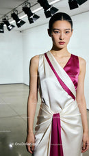 Elegant Asian woman wearing silk white and magenta dress
