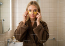 Young Woman Applying Eye Masks for Skincare Relaxation