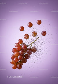 Fresh red grapes submerged in sparkling water splash
