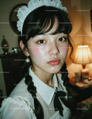 Young Girl in Vintage Maid Costume with Braided Hair and Lace Headband