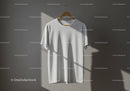 Minimalist white t-shirt hanging on wooden hanger