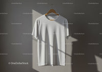 Minimalist white t-shirt hanging on wooden hanger