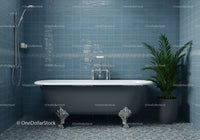Elegant clawfoot bathtub in stylish blue tiled bathroom