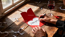 Handwriting A Romantic Love Note Beside Red Wine Glass