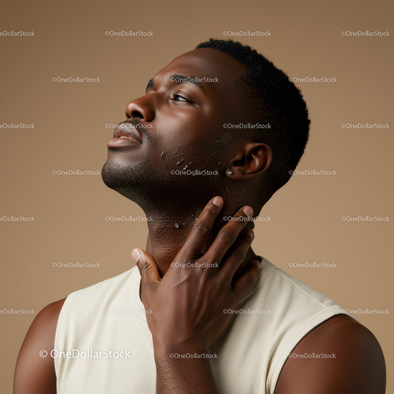 Elegant Man Applying Moisturizer on His Face for Skincare Routine