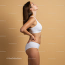 Elegant Woman in White Sportswear Showcasing Confidence and Fitness