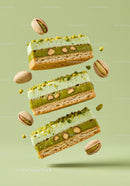 Delicate Pistachio Cream Cakes with Nuts on Green
