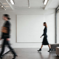 Blurry motion of two women walking in modern gallery