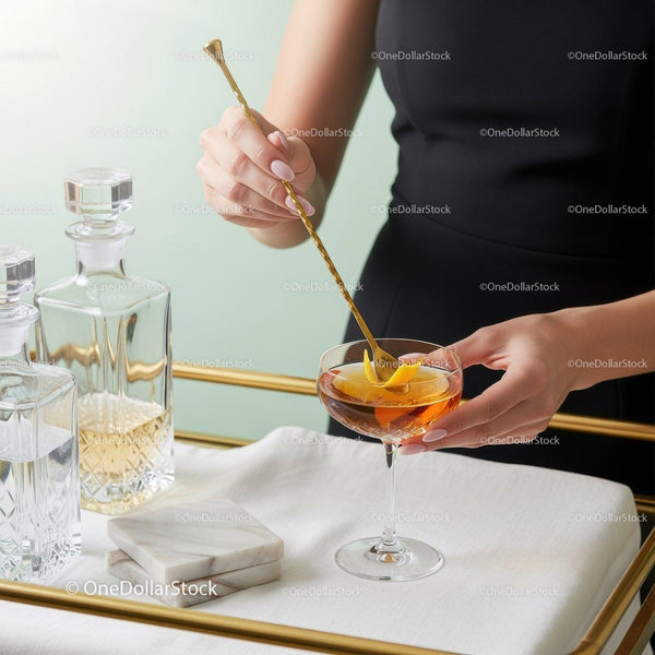 Elegant Cocktail Mixing Scene with Gold Stirring Stick and Stylish Glassware