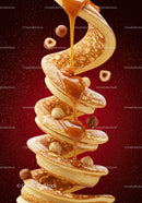 Stack of pancakes with caramel sauce and hazelnuts