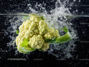 Fresh Green Cauliflower in Water Splash