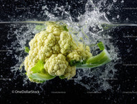 Fresh Green Cauliflower in Water Splash