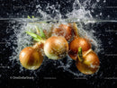 Fresh Brown Onions Splashing in Water with Dynamic Motion