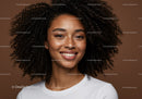 Confident Young Woman with Curly Hair and Bright Smile