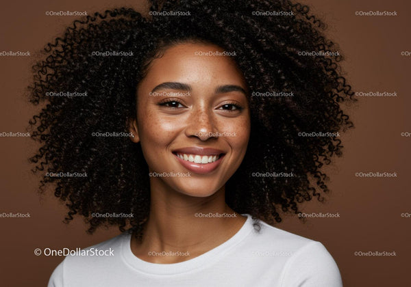 Confident Young Woman with Curly Hair and Bright Smile