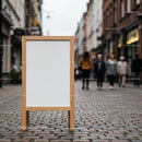 Wooden Frame Blank Signboard on Urban Cobblestone Street
