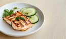 Grilled Fish with Cucumber and Salad in White Bowl