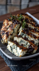 Artisan Blue Cheese Wheel on Dark Rustic Surface in Gourmet Food Setting